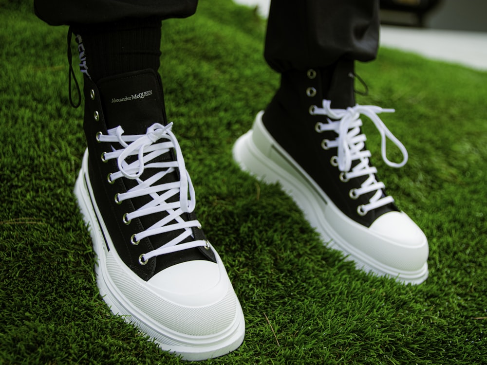 person wearing black and white adidas sneakers photo – Free Grass Image on  Unsplash
