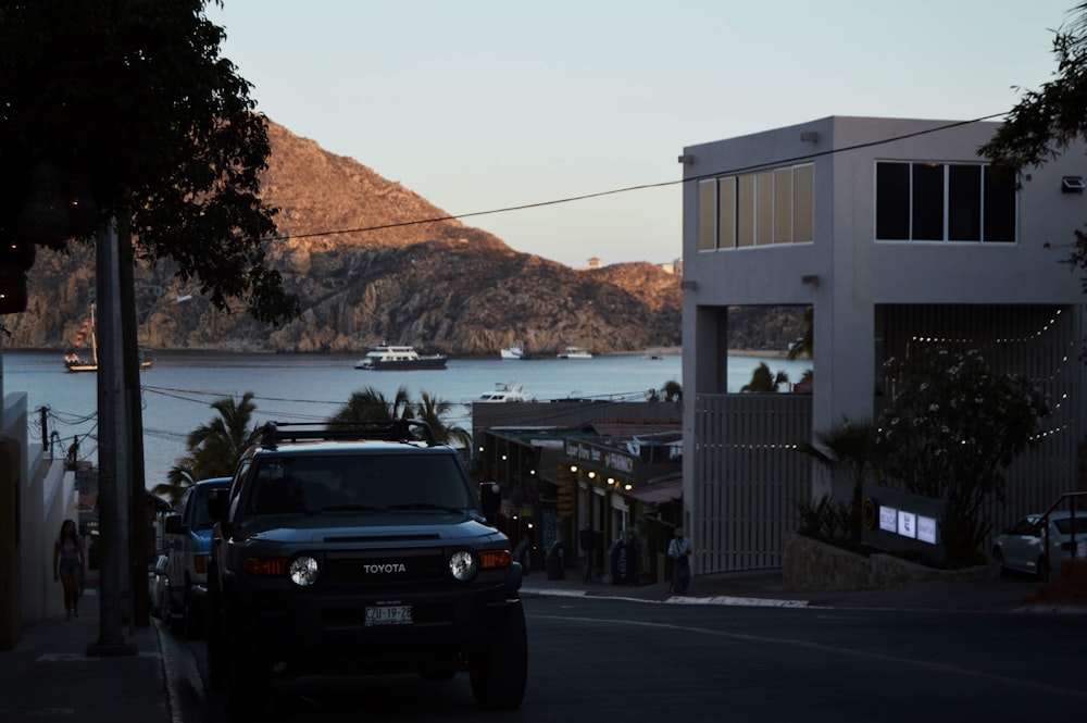 black suv parked near building during daytime