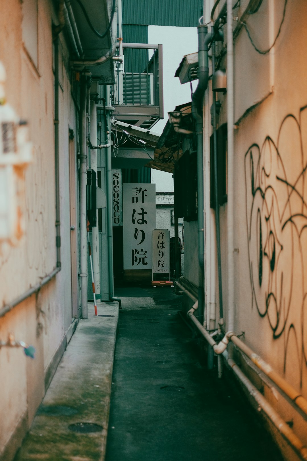 white and black graffiti on wall