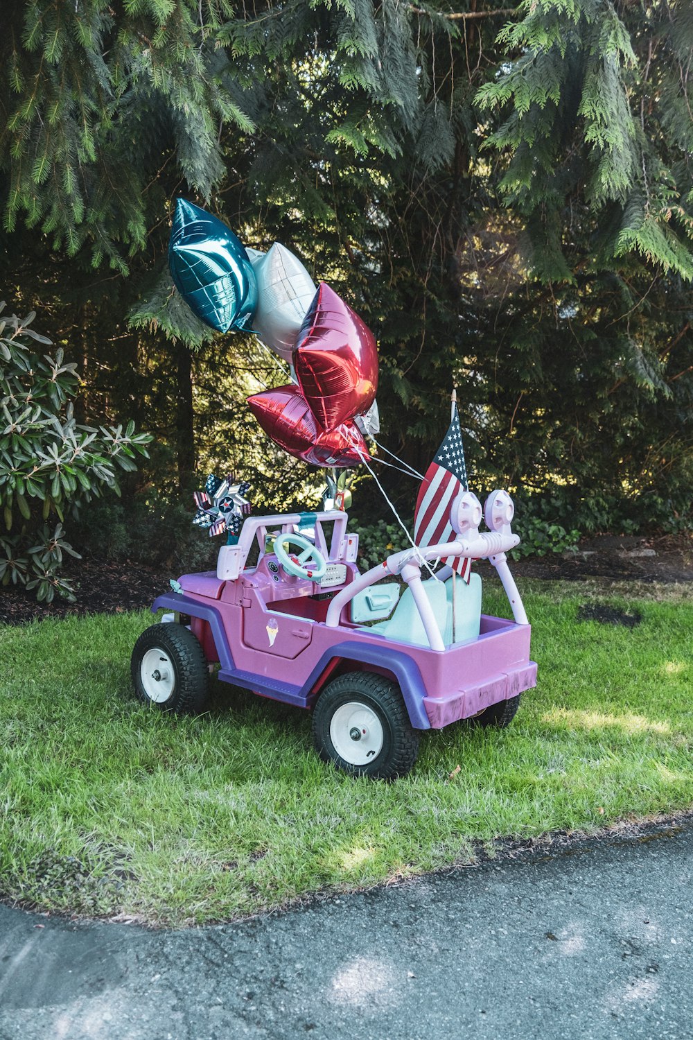 pink and white ride on toy car