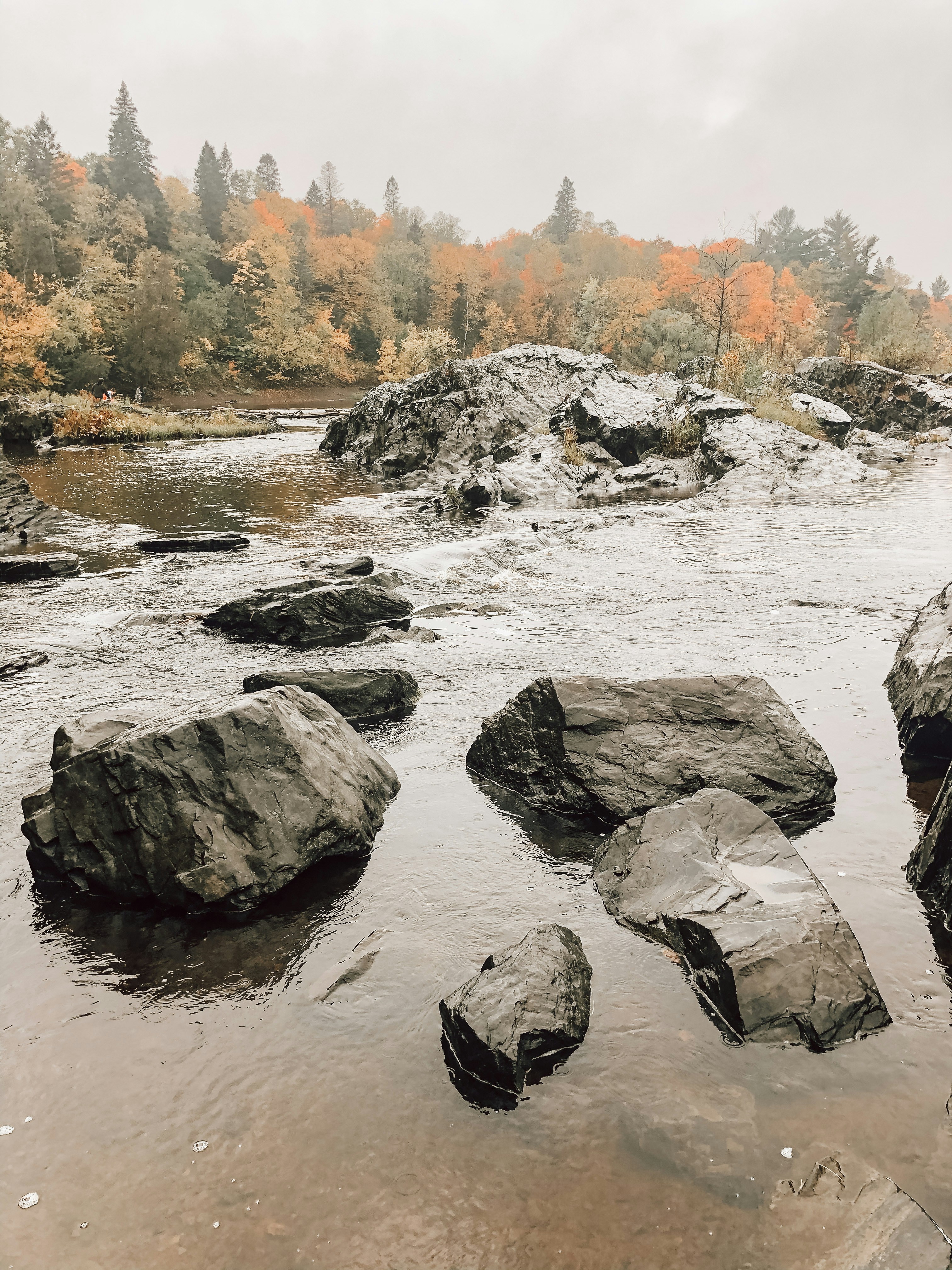 gray rocks on river during daytime