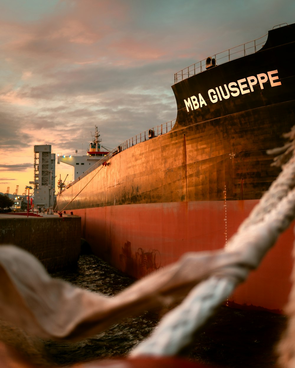 black ship on dock during sunset