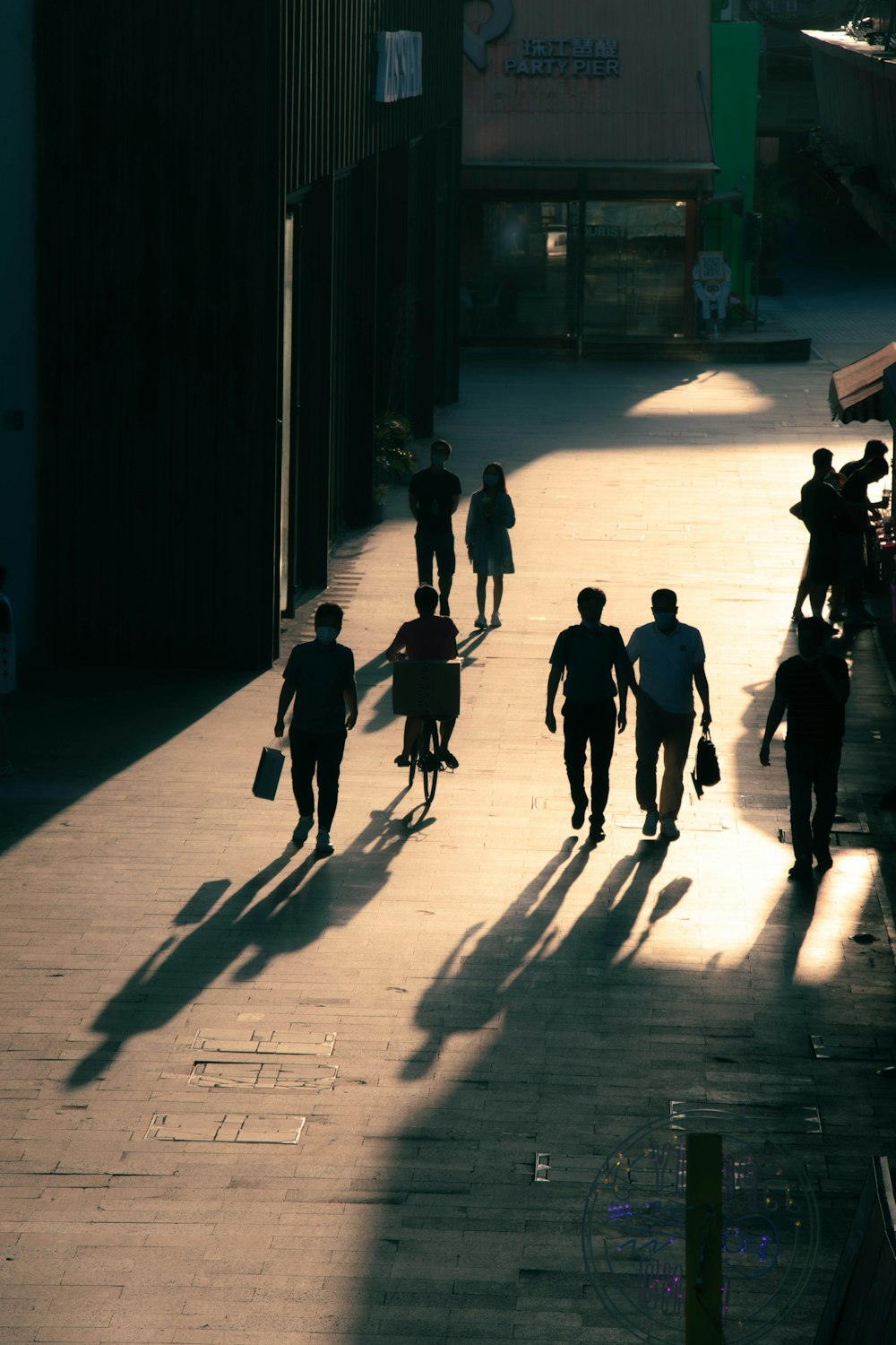 people walking on sidewalk during daytime