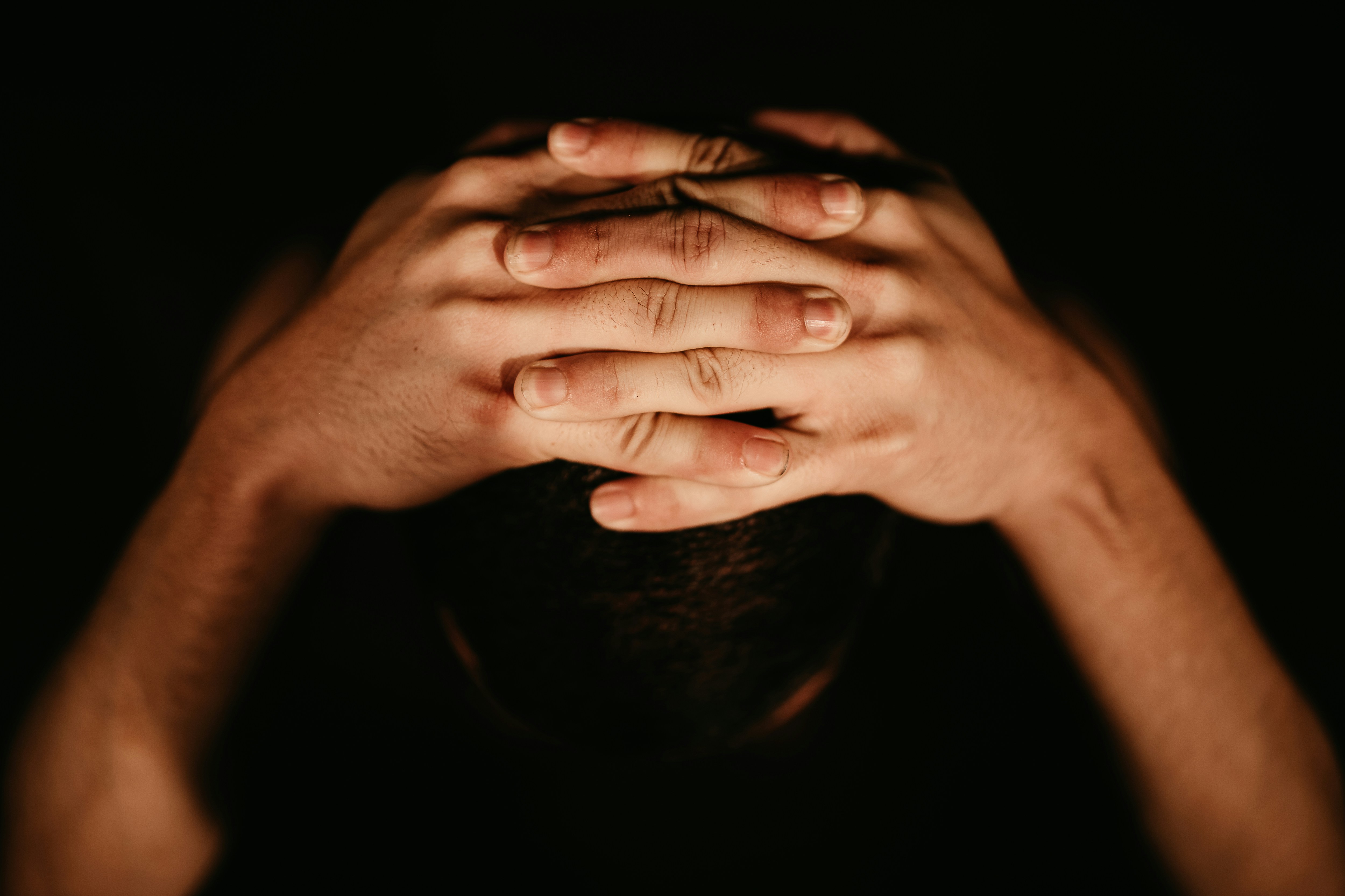 persons left hand on black surface