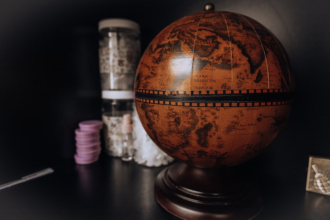 brown and black desk globe