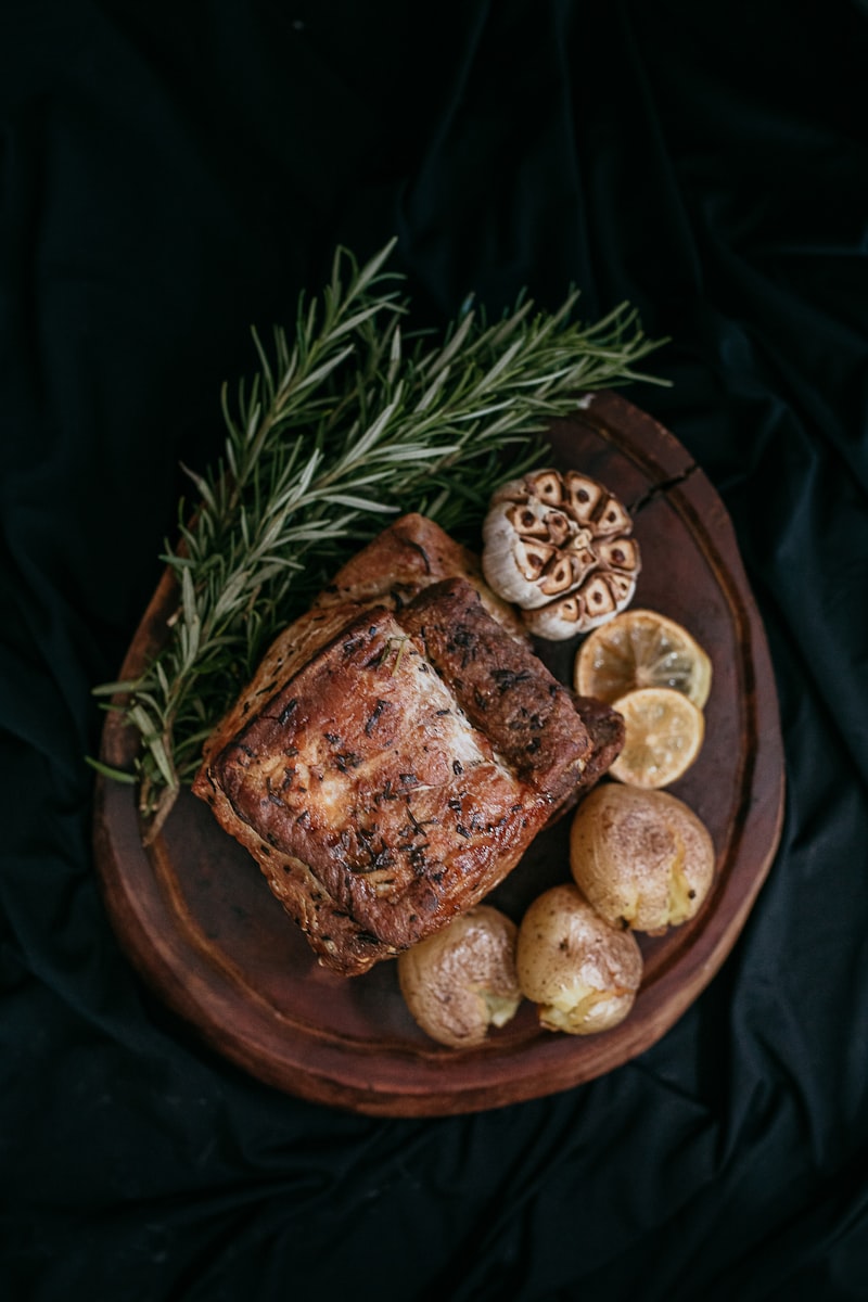 A rustic loaf of crusty bread on a wooden board