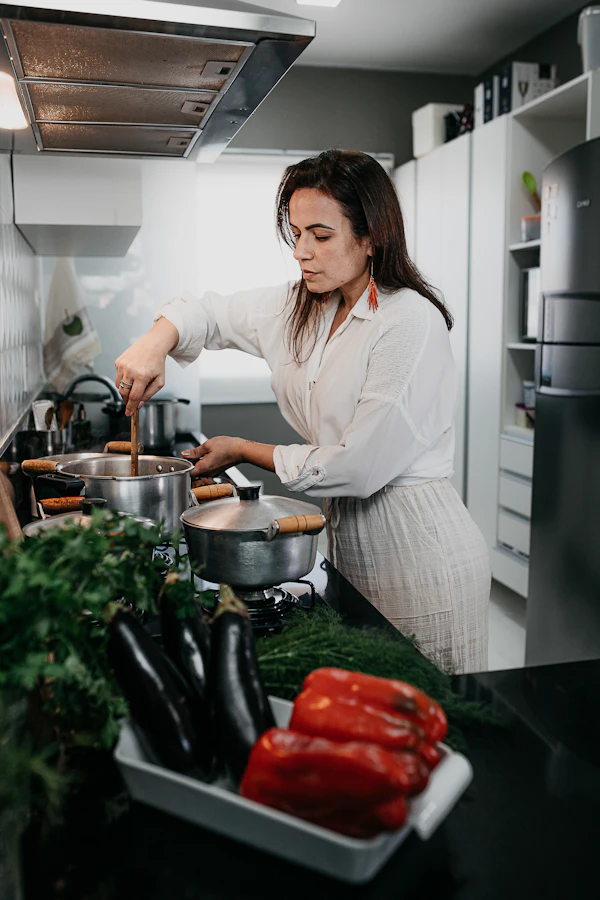 Indian woman cooking in kitchen