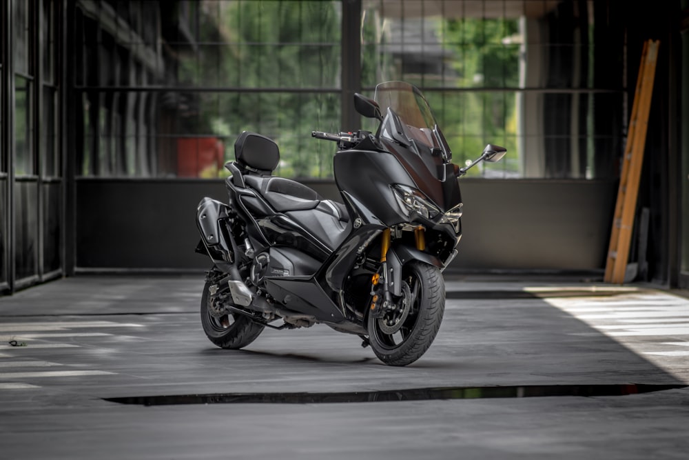 black sports bike on road during daytime