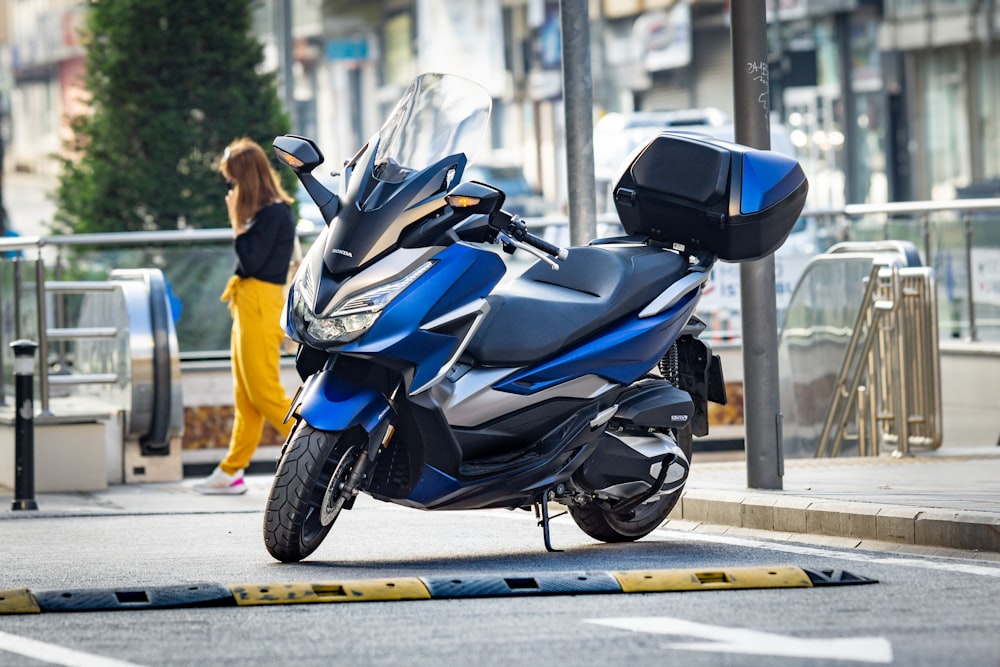 man in black jacket riding black sports bike