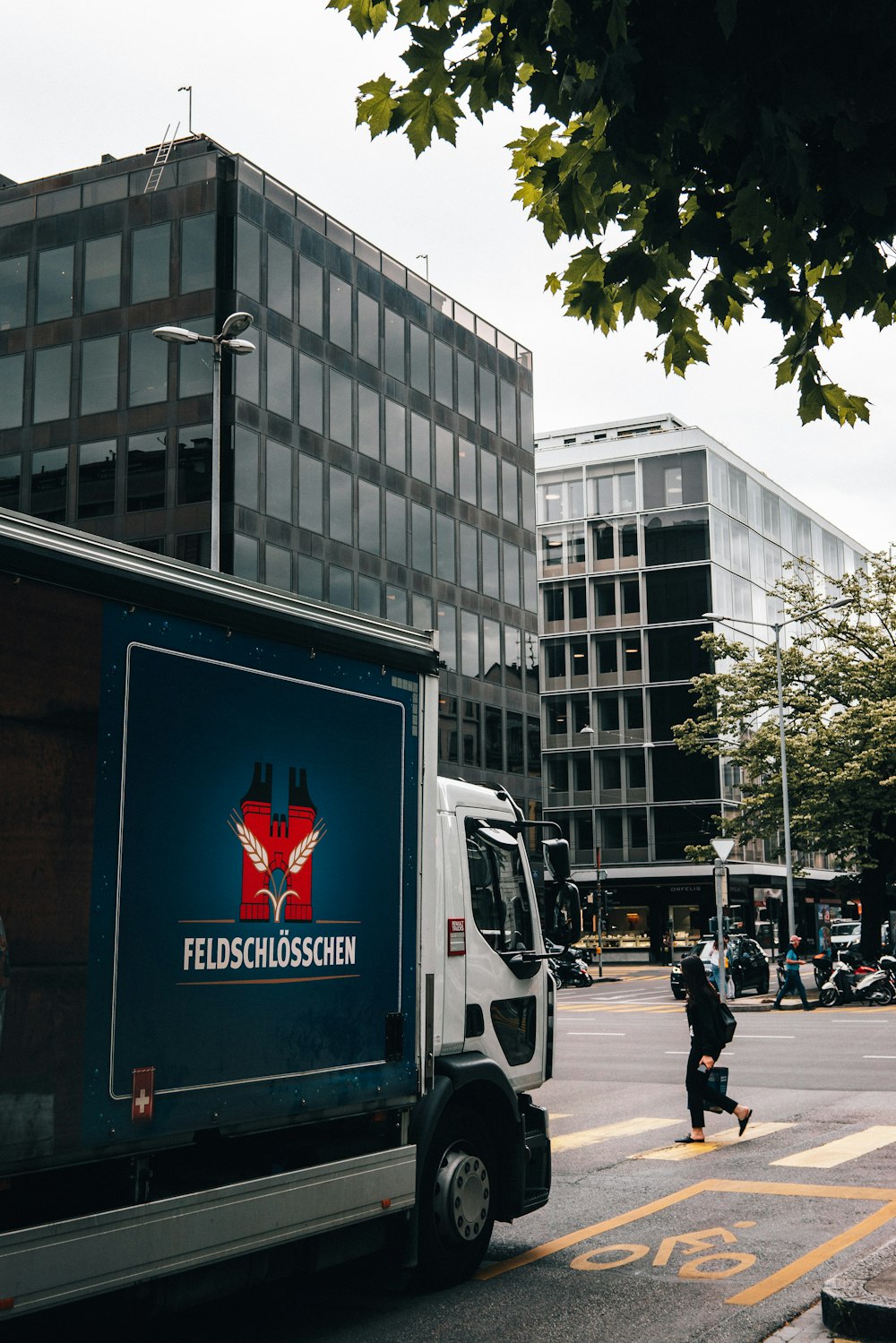 white and red van on road near building during daytime