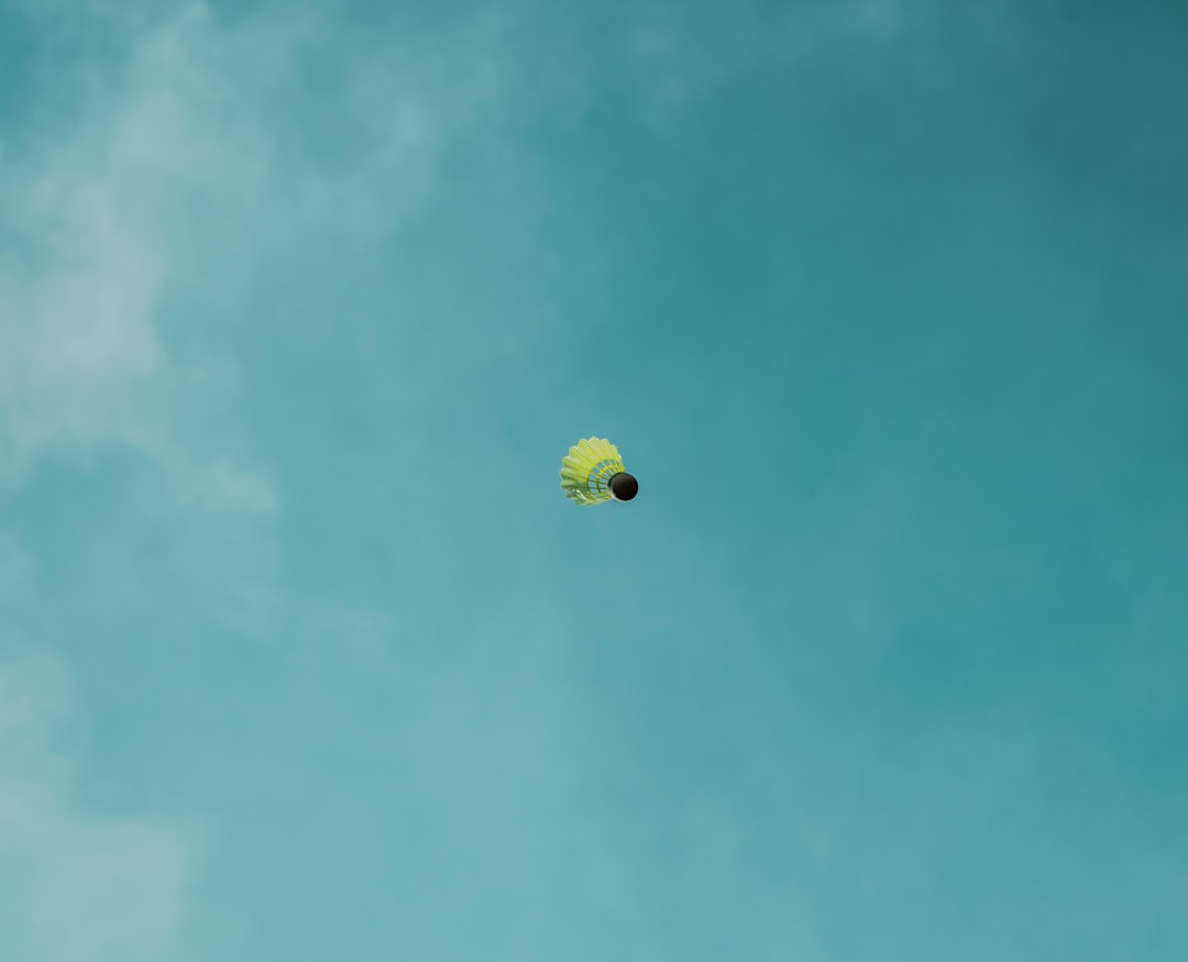 yellow balloon on blue sky