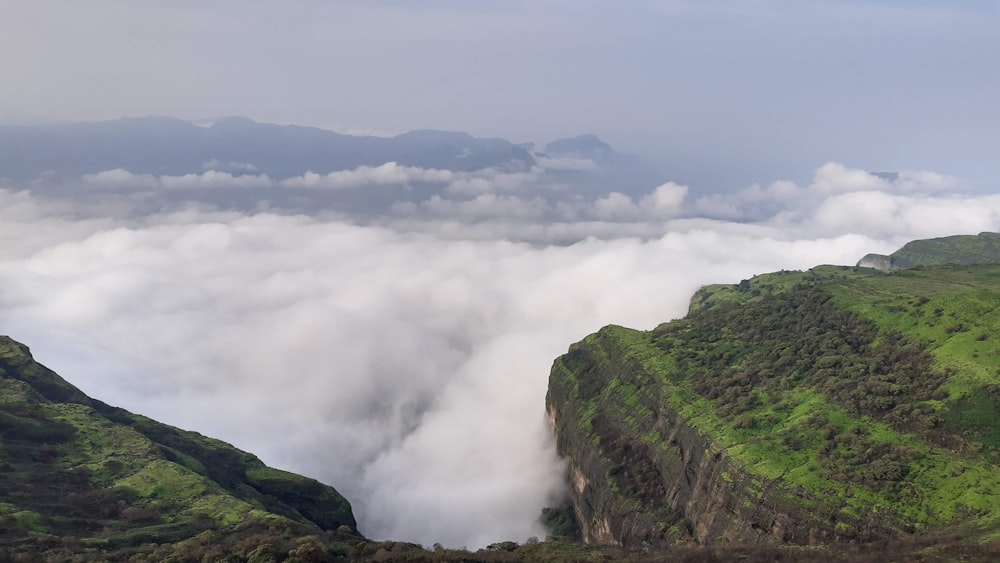 green and brown mountain under white clouds during daytime