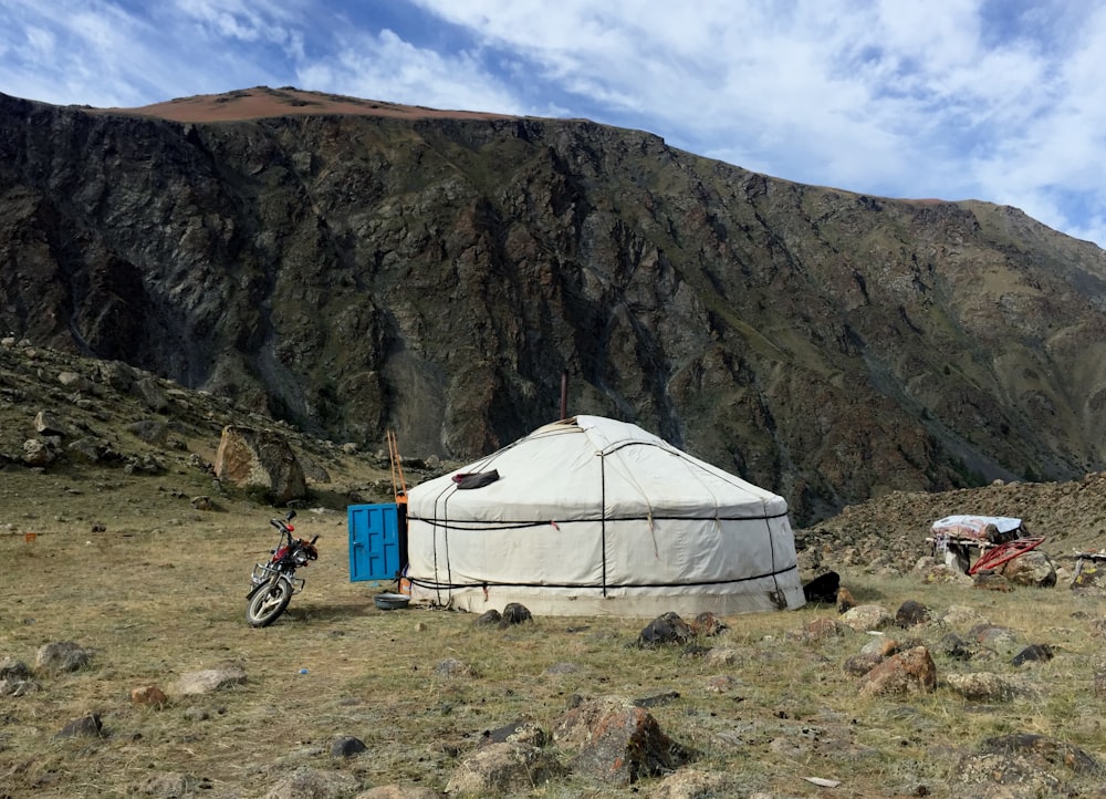 white tent near mountain during daytime