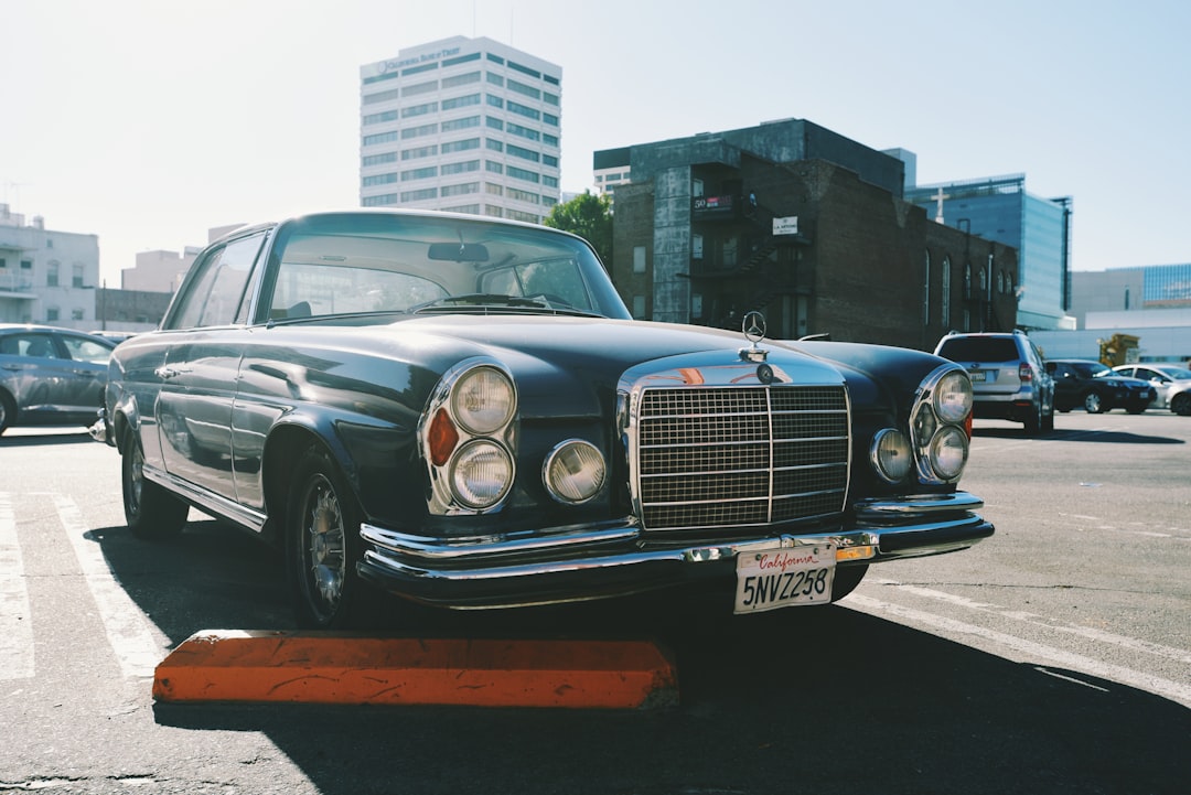 black mercedes benz car on road during daytime