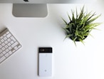 black iphone 5 on white table