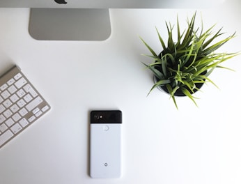black iphone 5 on white table