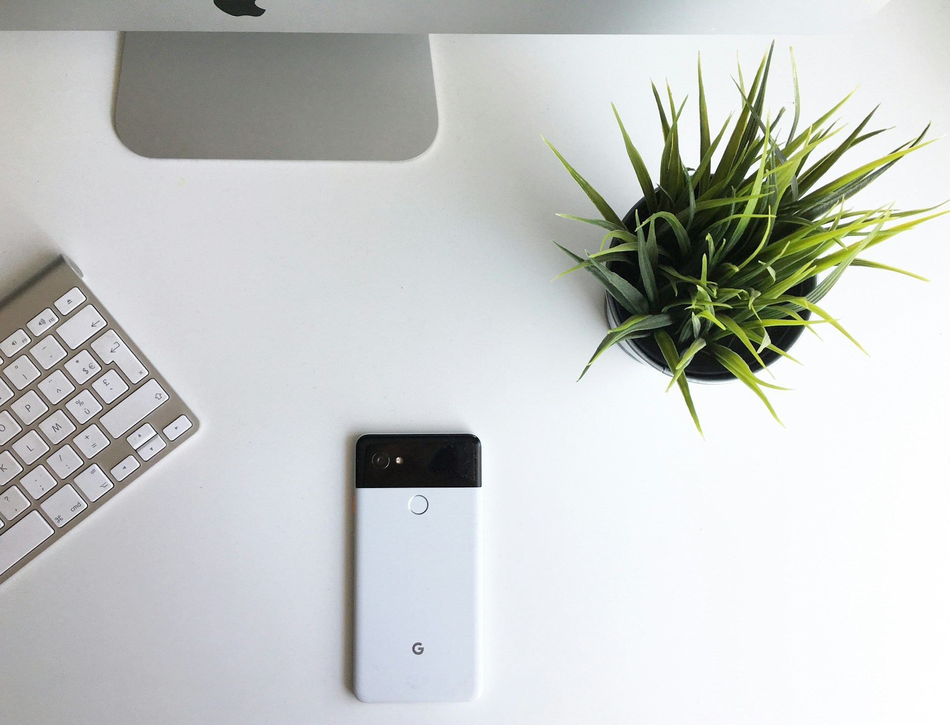 black iphone 5 on white table