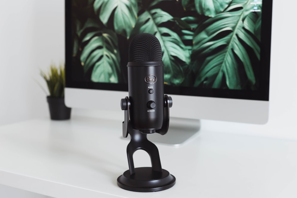 black microphone on white table