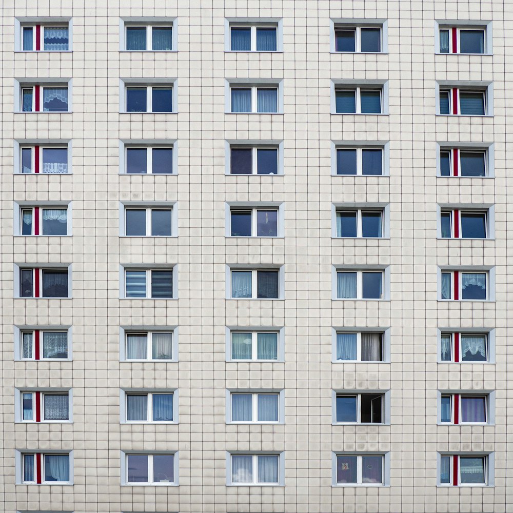 white concrete building with glass windows