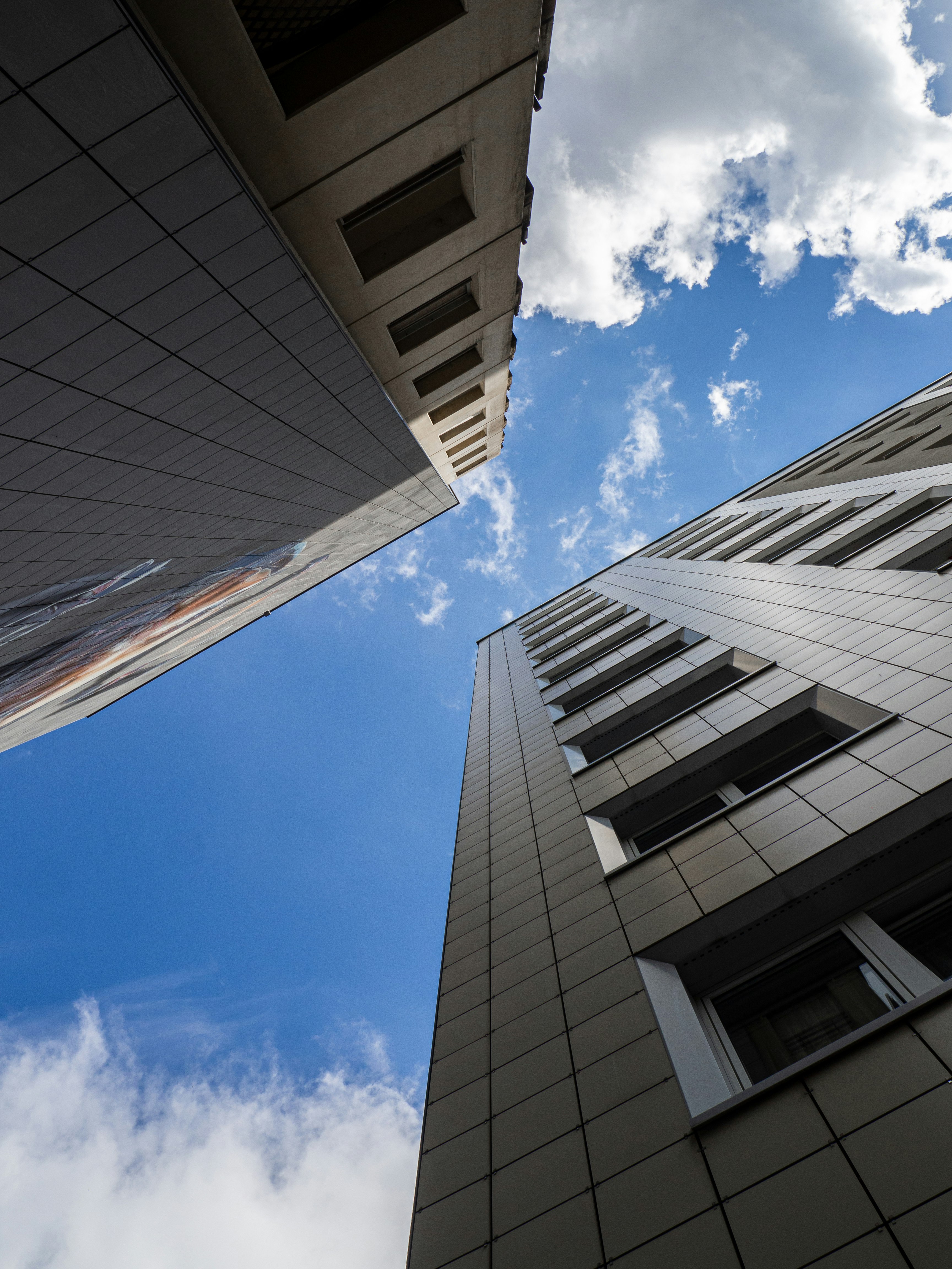 white and gray concrete building under blue sky during daytime