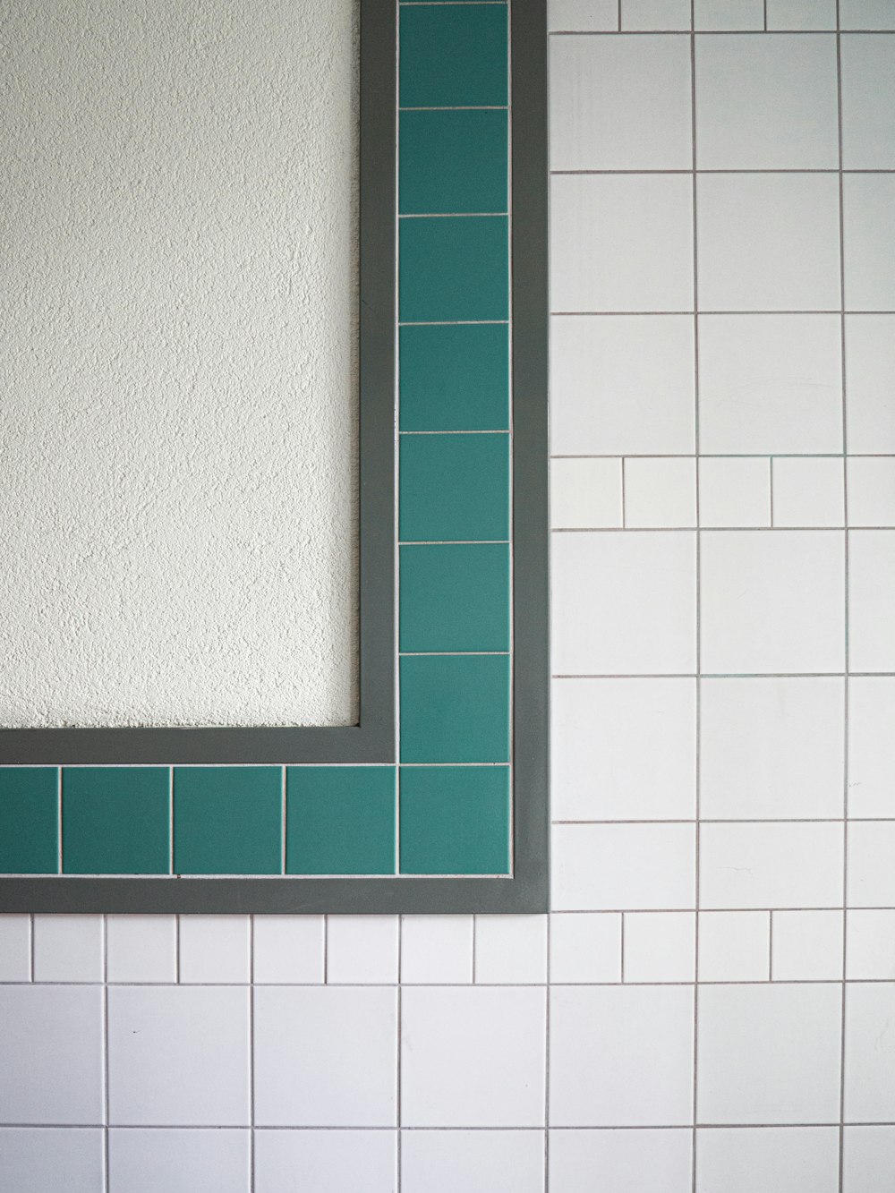 green wooden frame on white ceramic tiles