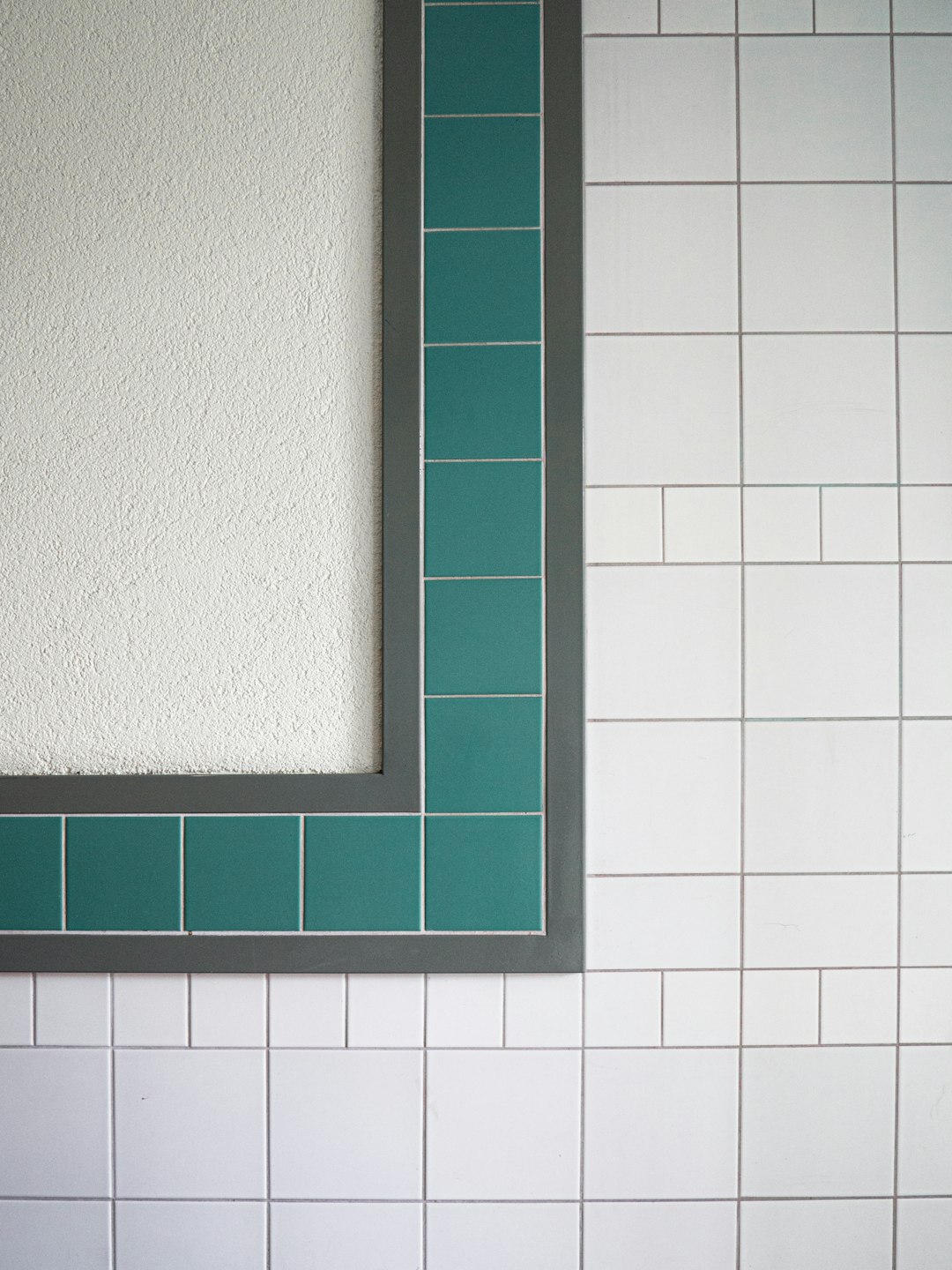 green wooden frame on white ceramic tiles