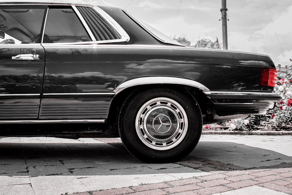 grayscale photo of car on road