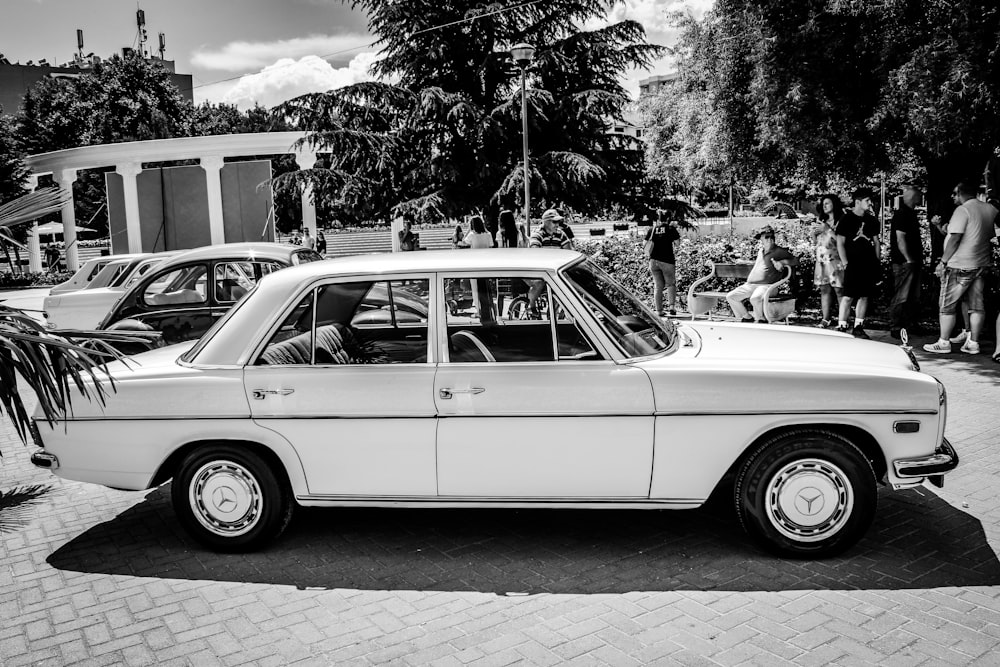 grayscale photo of vintage car