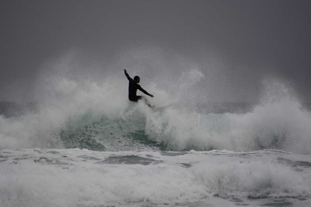 man surfing on sea waves