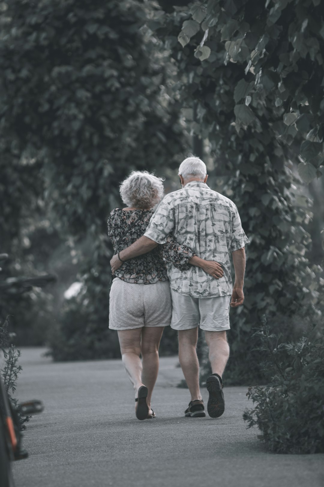 man and woman walking on the street during daytime