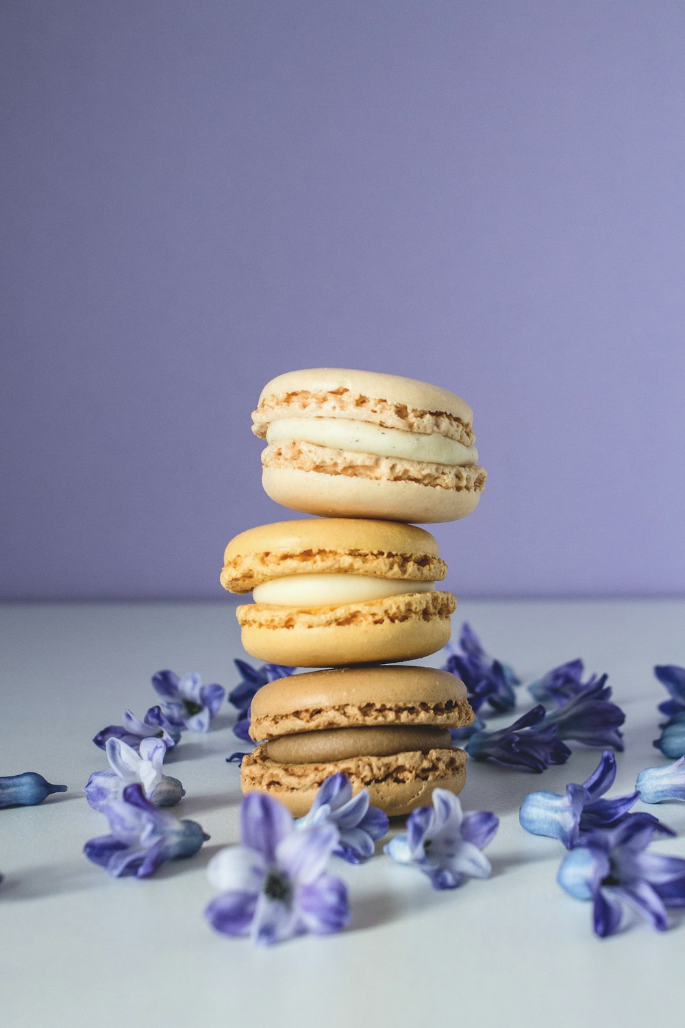 3 brown cookies on white surface