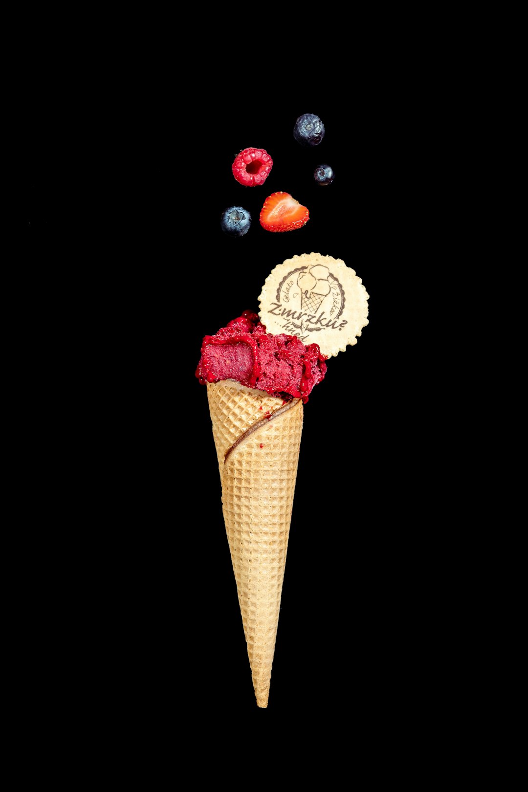 ice cream cone with red and white ice cream