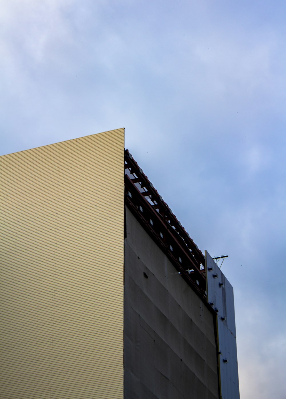 brown concrete building under blue sky during daytime