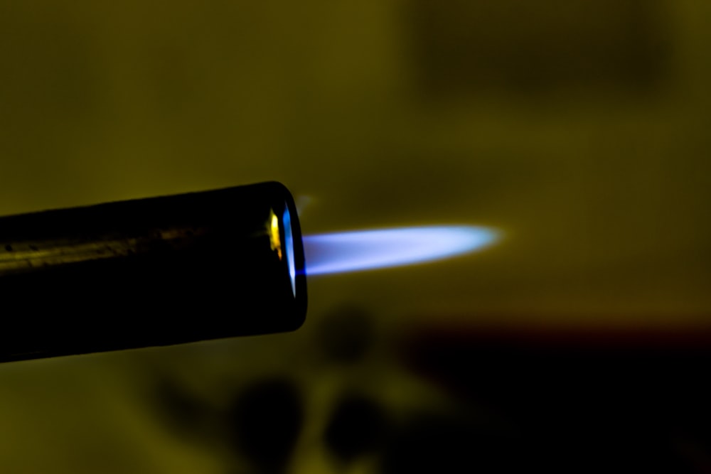 black lighter with fire in the middle