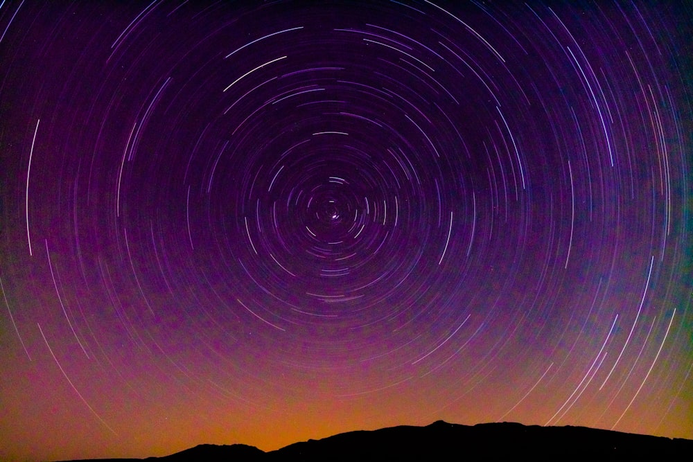 time lapse photography of stars in the sky during night time