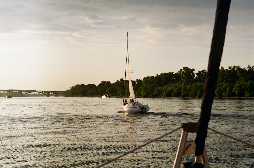 white boat on sea during daytime