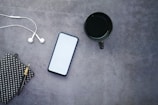 white iphone 5 c beside black round frame