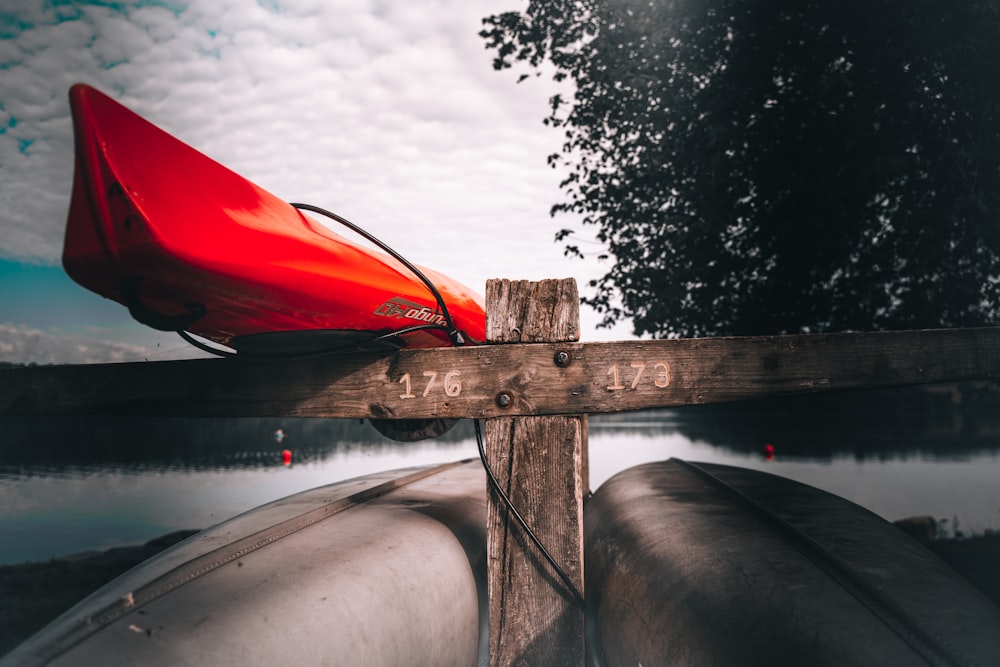 red and white kayak on water