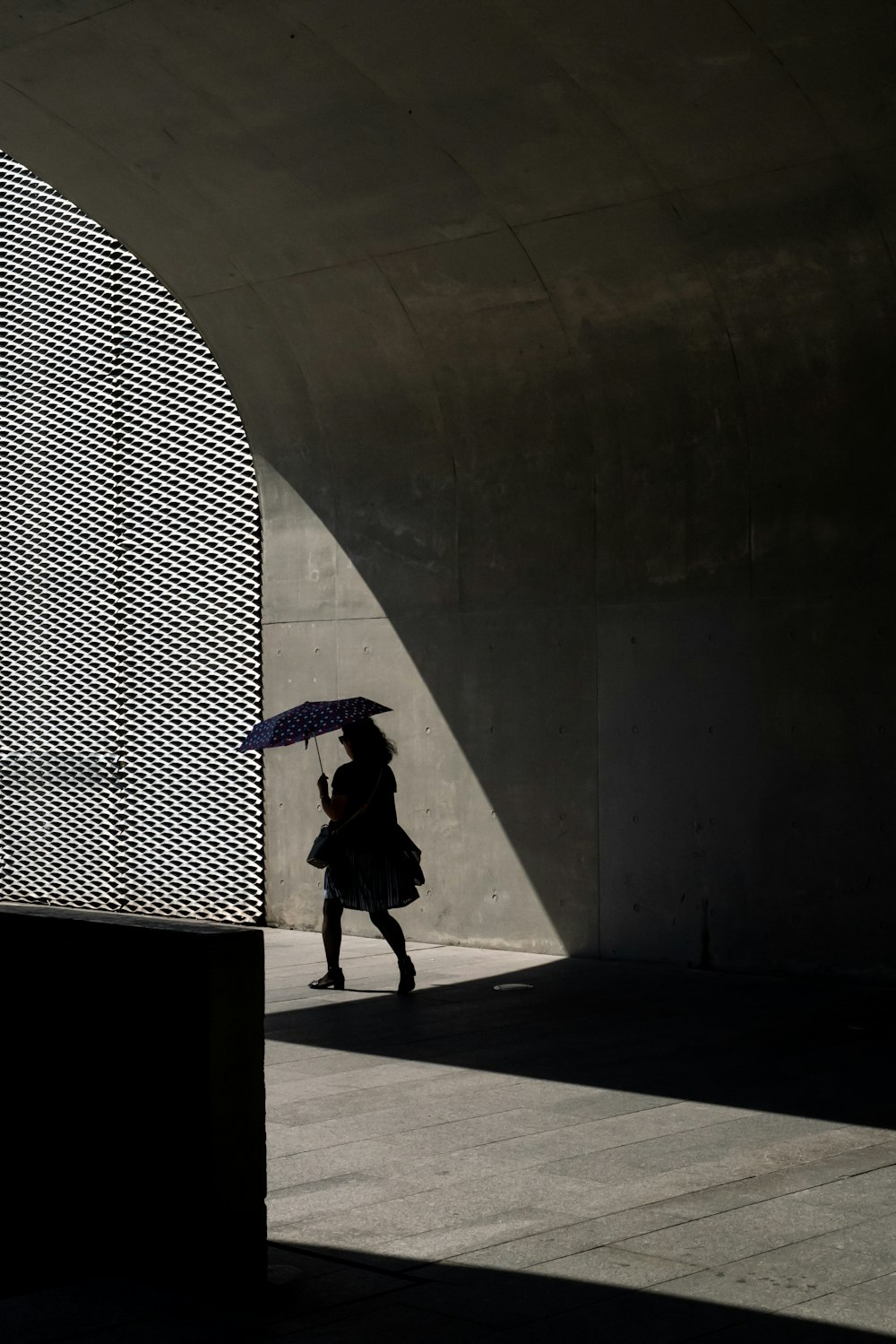 person walking on sidewalk during daytime