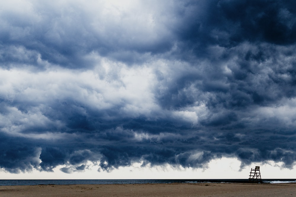 white clouds over brown field