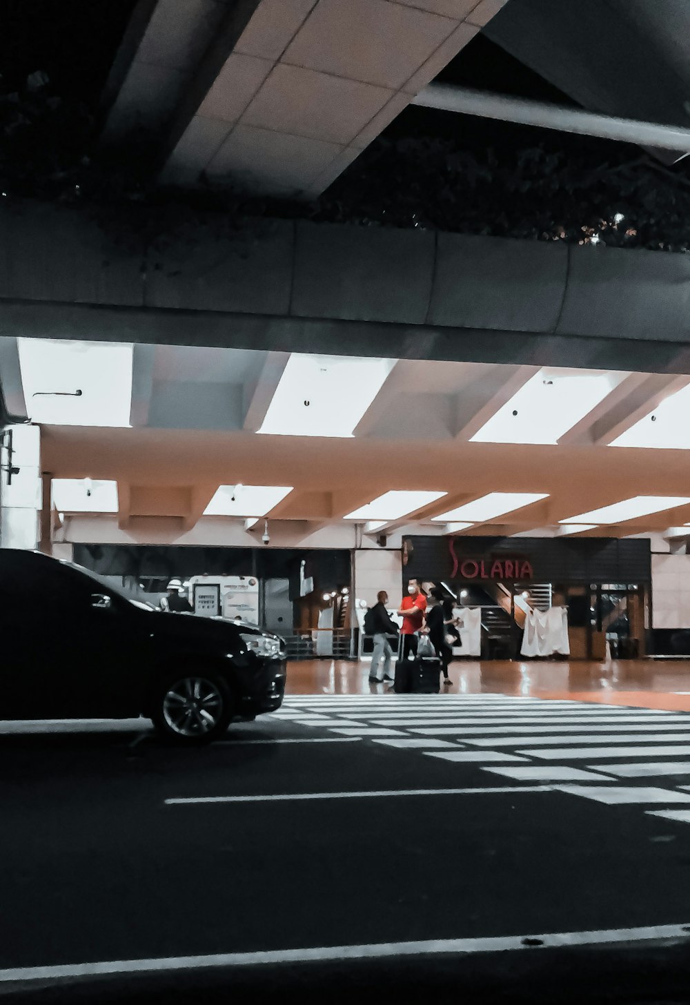 people walking on pedestrian lane during night time