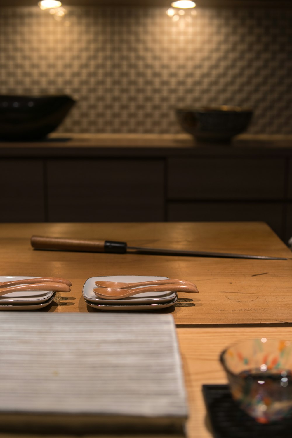 black and brown ceramic bowls on brown wooden table