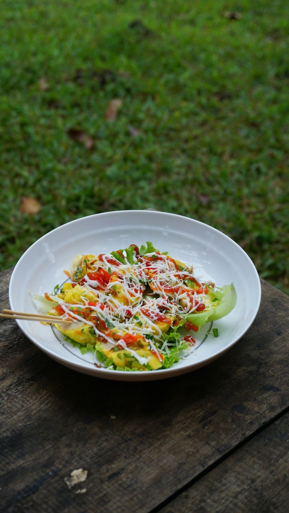 vegetable salad on white ceramic bowl