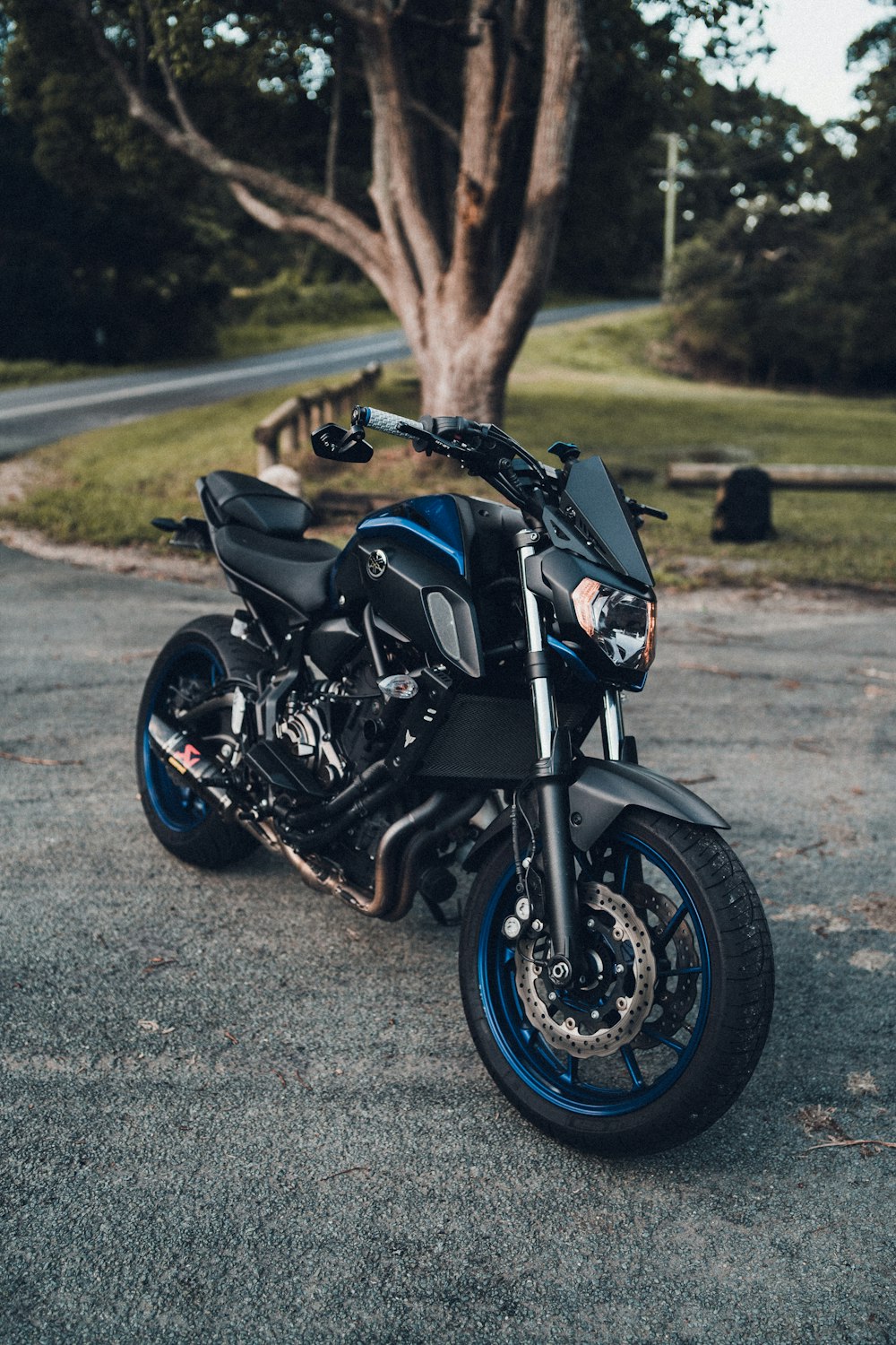 black sports bike on gray asphalt road during daytime