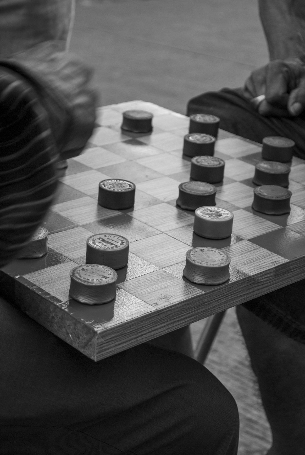 grayscale photo of chess pieces on chess board