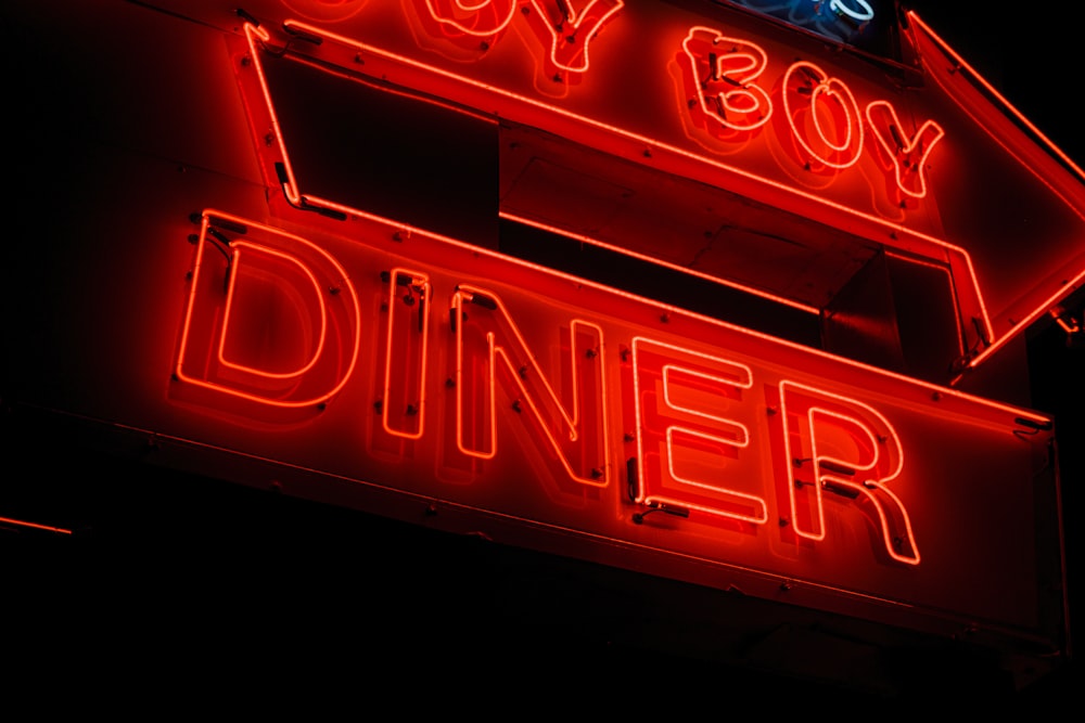 red and white open neon signage