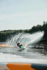 2 person riding on blue kayak on water during daytime