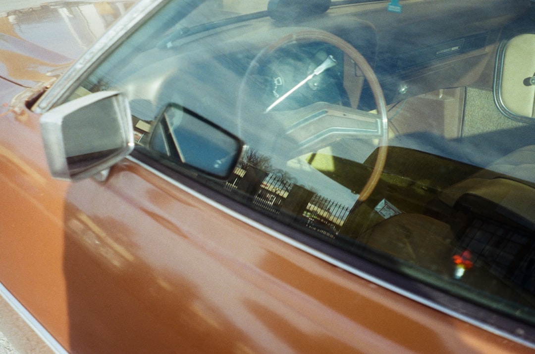 red car with white steering wheel