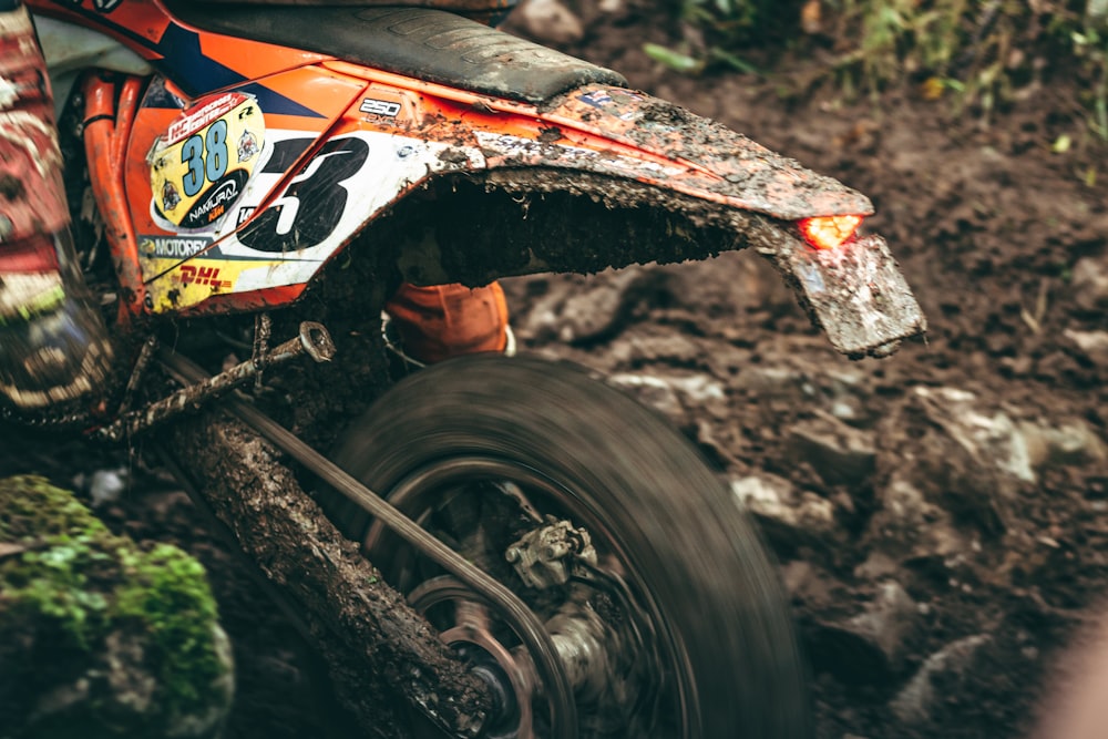 red and black atv on brown soil