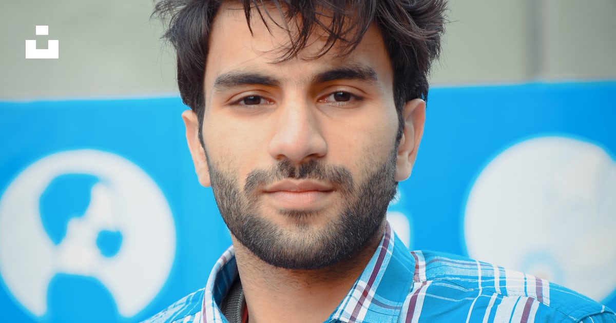 Man In Blue Red And White Plaid Button Up Shirt Photo Free Pakistan man-in-blue-red-and-white-plaid-button-up-shirt-photo-free-pakistan